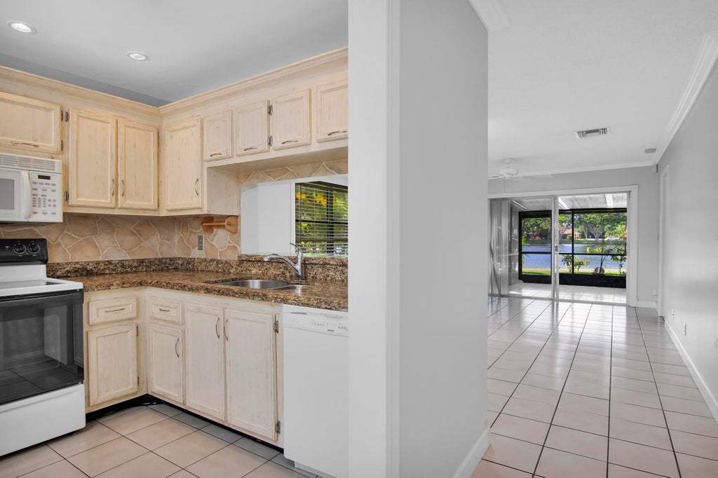 Photo of 5171 Tennis Lane, Delray Beach, FL 33484 (MLS # B26081326)