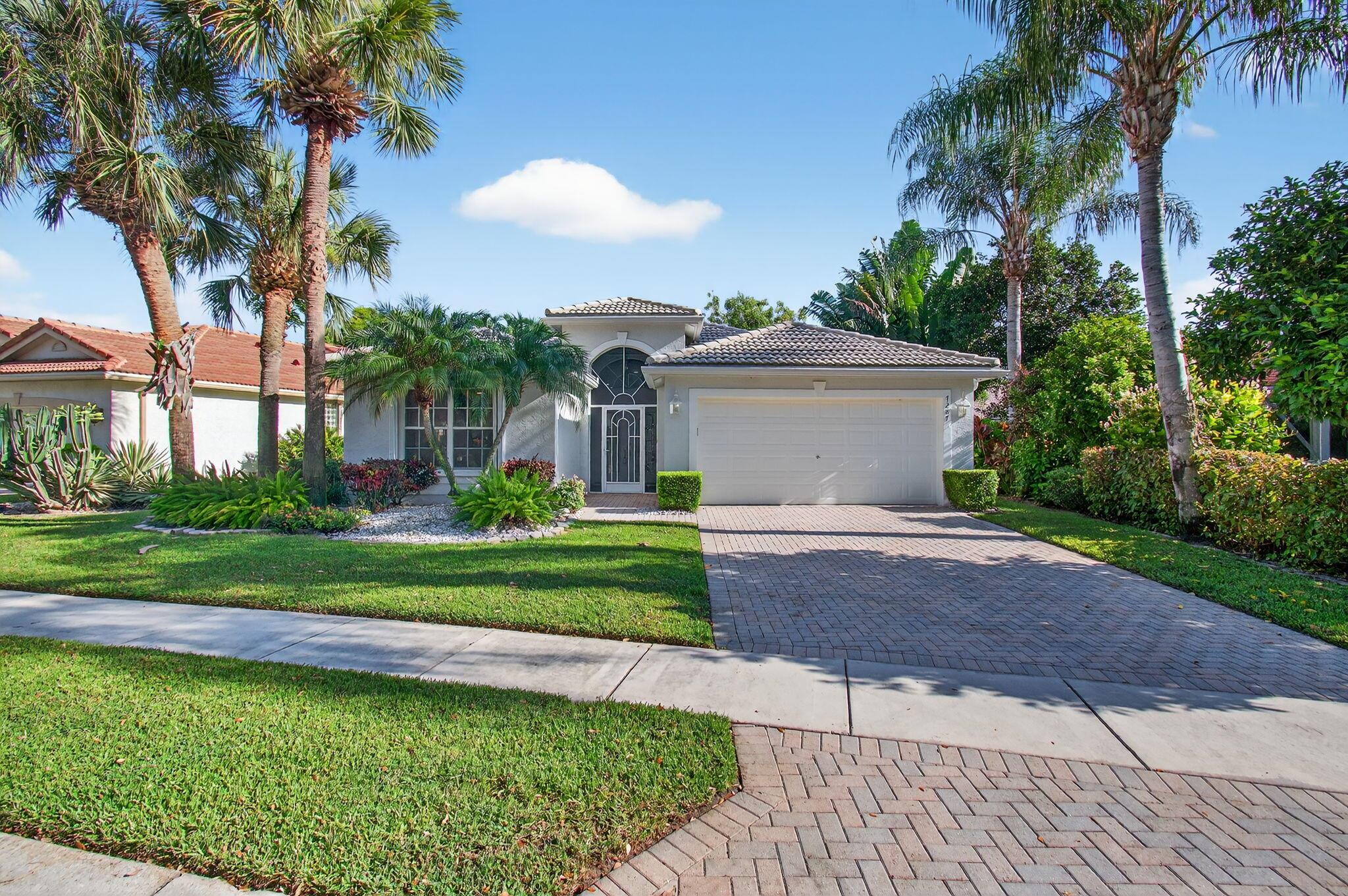 Experience the best of lakefront living in this fully REMODELED 3-bedroom,2-bath home in the sought-after Valencia Isles community.A BRAND-NEW ROOF is being installed,complementing the modern upgrades throughout. Inside,you'll find new flooring, recessed lighting, and smooth ceilings with the popcorn removed for a fresh, contemporary feel.The spa-like primary suite features a soaking tub,walk-in shower, and spacious walk-in closets.The chef's kitchen boasts two-tone soft-close cabinetry, quartz countertops,all-new appliances, and convenient under-bar seating.Enjoy breathtaking water views from the huge tiled covered patio,perfect for entertaining.Additional highlights include a 2023 AC system and accordion shutters for peace of mind. Valencia Isles offers beautifully landscaped and resort