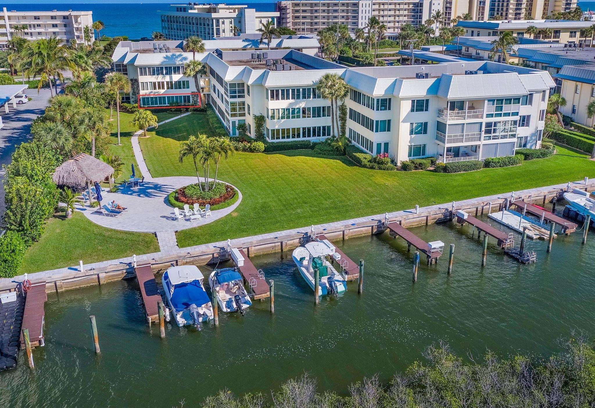 Available October 2024 through 2025 Season. Min of 3 months; 6 month lease ideal. Welcome this completely renovated 2/2 condo in Island House Southwest, a water lover's paradise. This building is located on the South end of Jupiter Island right on the beautiful, turquoise Intracoastal waterway. Enjoy being steps from the ocean with a private beach access. Lower level unit with beautiful garden and intracoastal views to watch the boats sail by. This coastal furnished condo offers plantation shutters, wide wood plank tile floors, and hurricane impact windows. King beds in both bedrooms and a single twin in sunroom off of master. Condo has been recently redecorated with new beachside decor. Deeded walkway to beach about 50 yards away, community pool, floating dock.