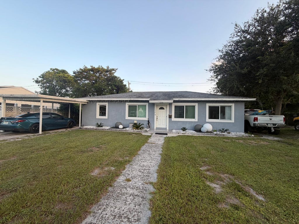 Photo of 1038 MACY Street, West Palm Beach, FL 33405 (MLS # B26070431)