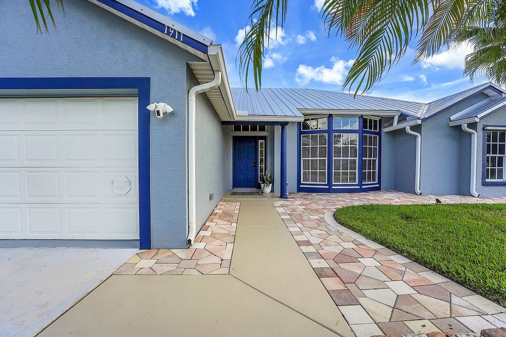 Photo of 1911 SW Janette Avenue, Port Saint Lucie, FL 34953 (MLS # R11160457)