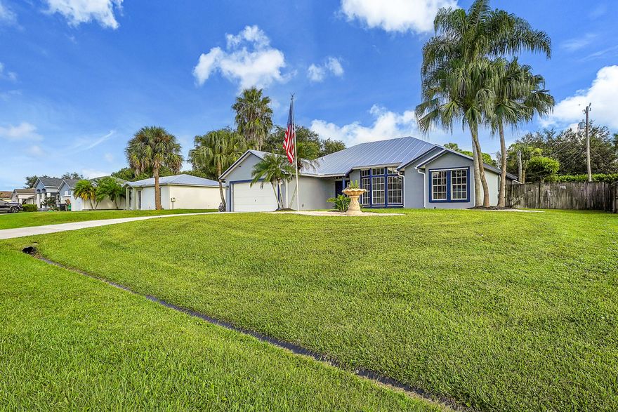 Welcome to this MODEL-HOME caliber, resort-style 3-bedroom, 2-bath Heated Pool  positioned between Tradition &St. Lucie West with NO HOA & NO impact fees.
This very well designed home has been finished to true model-home standards & offers a bright, open floor plan with high vaulted ceilings, skylights, seamless flow,  &cohesive designer aesthetic throughout. freshly painted interior & exterior  the home features coordinated ceiling fans &blinds, updated lighting throughout, LED-lit bathrooms.
Stunning kitchen quartz countertops, brand-new Frigidaire appliances, a dedicated coffee bar, reverse osmosis water system.  NEW ROOF (2024), NEW A/C SYSTEM (2024), ALL NEW DUCTWORK (2024), NEW HOT WATER HEATER (2024),  NEW POOL HEATER (2025). PREPPED FOR BOAT OR RV PARKING WITH DOUBLE GATE