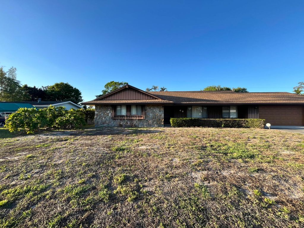 Photo of 68 W Arch Drive, Greenacres, FL 33467 (MLS # B26005098)