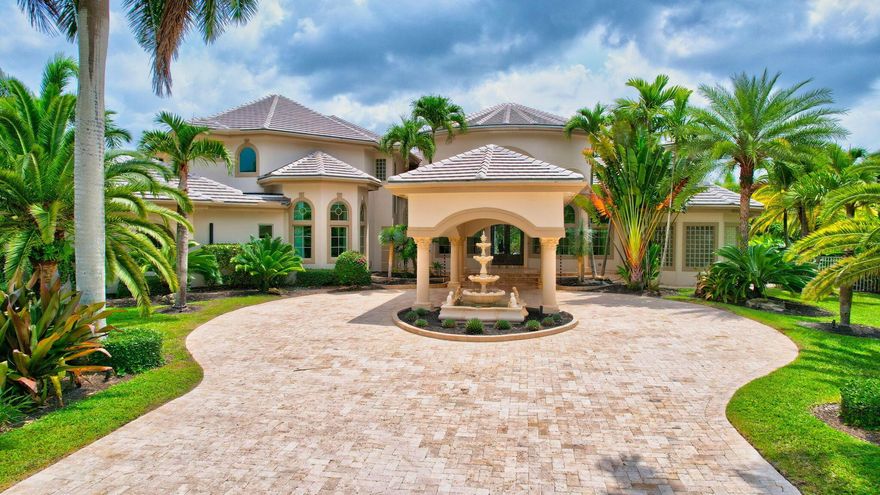 Exquisite Estate Home on over 1 acre Located in a 24hr man gated community. Specular Lake lot on private cul-de-sac streetTwo driveways.  4 car garage.  Recent upgrades; Brand new roof in 2023 & New impact windows in 2017. Home features 6 Bedrooms, Master and junior master bedrooms on first floor, 6 En-Suite bathrooms plus 1 half bath.  Interior floor plan is bright and spacious, with neutral colors throughout. Gorgeous kitchen designed with Mystery white honed marble on the kitchen island, Built in appliances/ and Thermador gas range. Huge covered outdoor space perfect for entertaining, Huge New infinity edge pool/ Spa, Heated, Salt System with large sun shelf completed in 2023.  Bubblers in sun deck and gutter.  Six-foot diameter fire bowl.