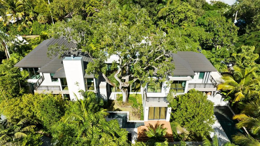 Welcome to your private sanctuary nestled in the heart of the Colee Hammock neighborhood in Fort Lauderdale. This home offers five bedrooms, an office plus a media room, complemented by five ensuite bathrooms and two powder rooms. The interior is fully furnished and further enhanced by a 504-bottle wine refrigerator, a gas fireplace surrounded by natural coral rock, an elevator, a three-car garage plus space for your golf cart, and the expansive windows and doors create a seamless flow to the outdoor living spaces. The outdoor living space is surrounded by Florida native landscaping and an Oak tree offering a serene atmosphere while enjoying the pool, spa, and Koi pond. This isn't just a house, it's a haven where every detail invites you to unwind and reconnect with family and friends.