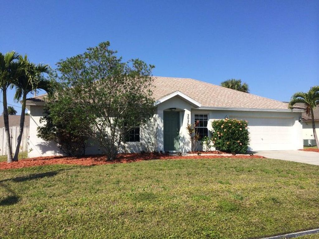 Photo of 2026 SE Parrot Street, Port Saint Lucie, FL 34952 (MLS # R10990202)