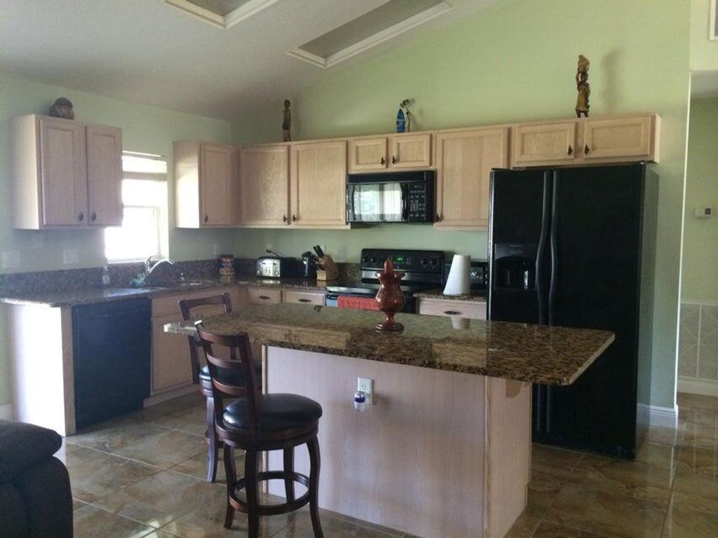 Photo of 2026 SE Parrot Street, Port Saint Lucie, FL 34952 (MLS # R10990202)