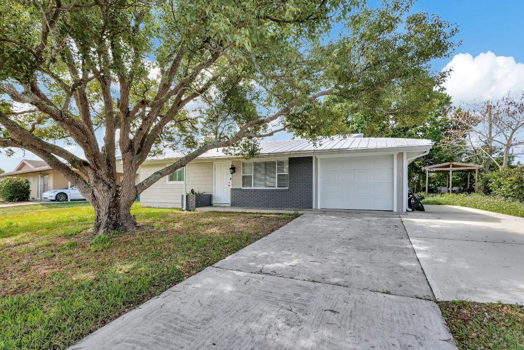Photo of 750 SW Airoso Boulevard, Port Saint Lucie, FL 34983 (MLS # R10966106)