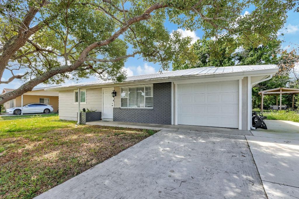 Photo of 750 SW Airoso Boulevard, Port Saint Lucie, FL 34983 (MLS # R10966106)