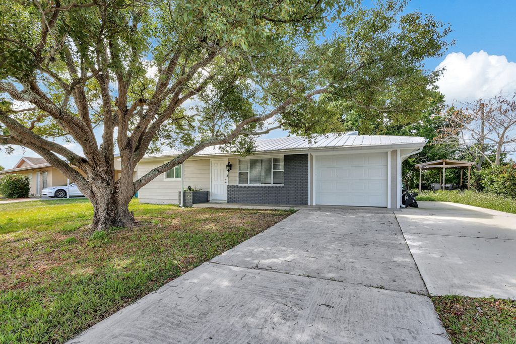 Photo of 750 SW Airoso Boulevard, Port Saint Lucie, FL 34983 (MLS # R10966106)