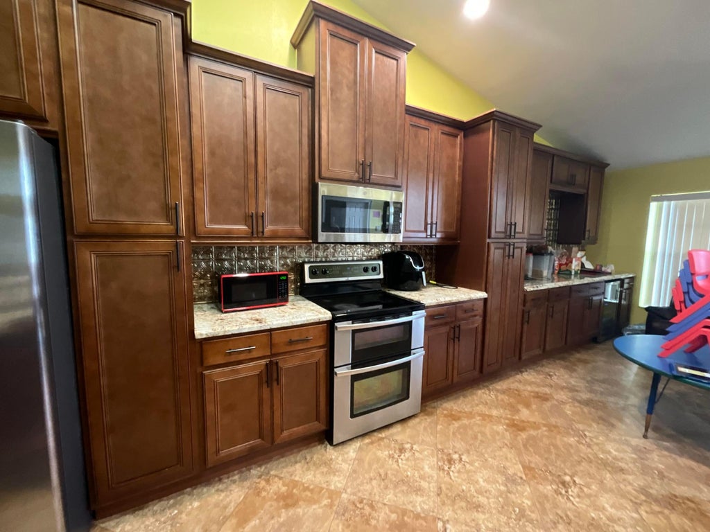 Photo of 315 SW Dwight Avenue, Port Saint Lucie, FL 34983 (MLS # B26059878)
