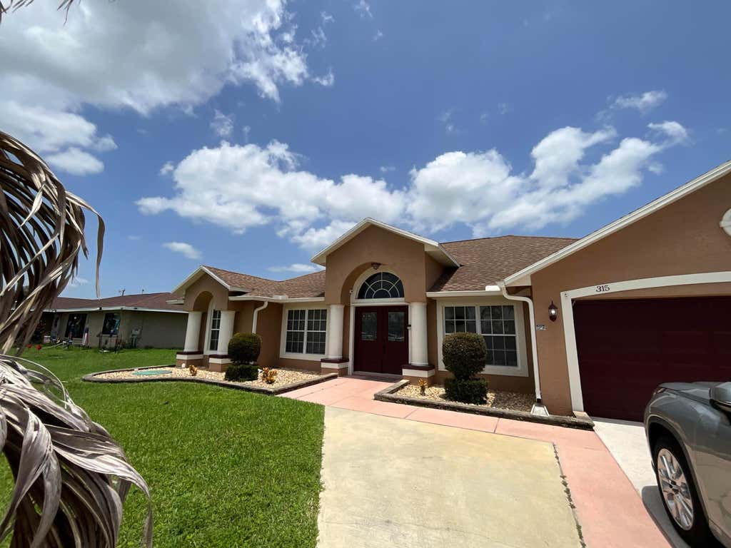 Photo of 315 SW Dwight Avenue, Port Saint Lucie, FL 34983 (MLS # B26059878)