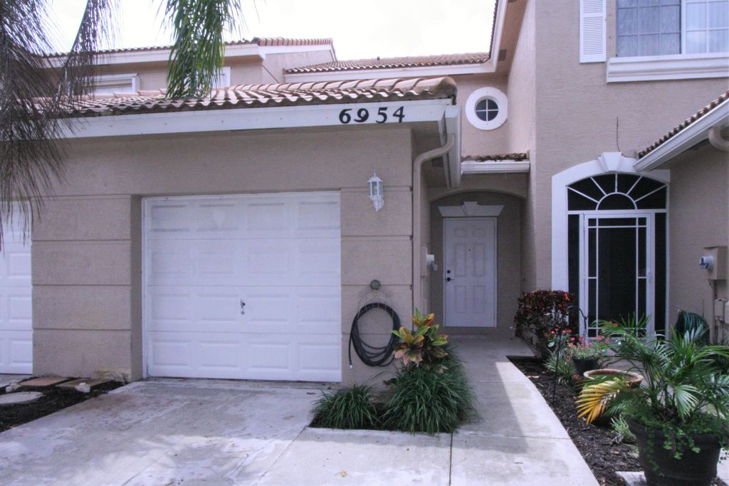 Photo of 6954 Oak Bridge Lane Ln, Lake Worth Beach, FL 33467 (MLS # R10808612)