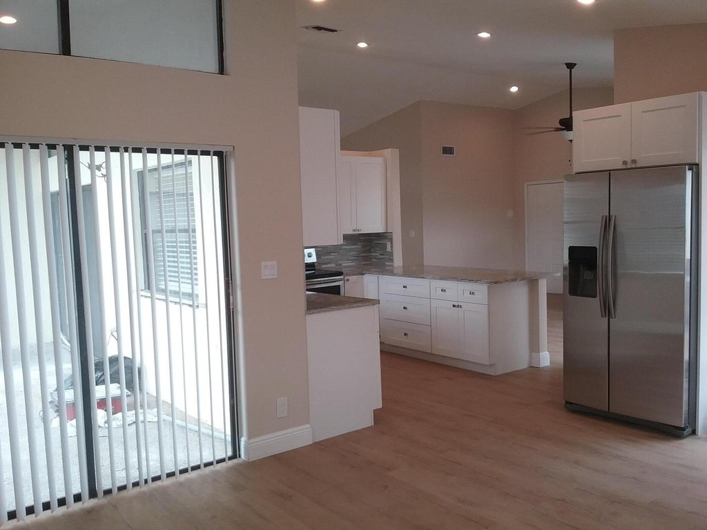 Photo of 21071 Woodspring Avenue, Boca Raton, FL 33428 (MLS # B26059075)