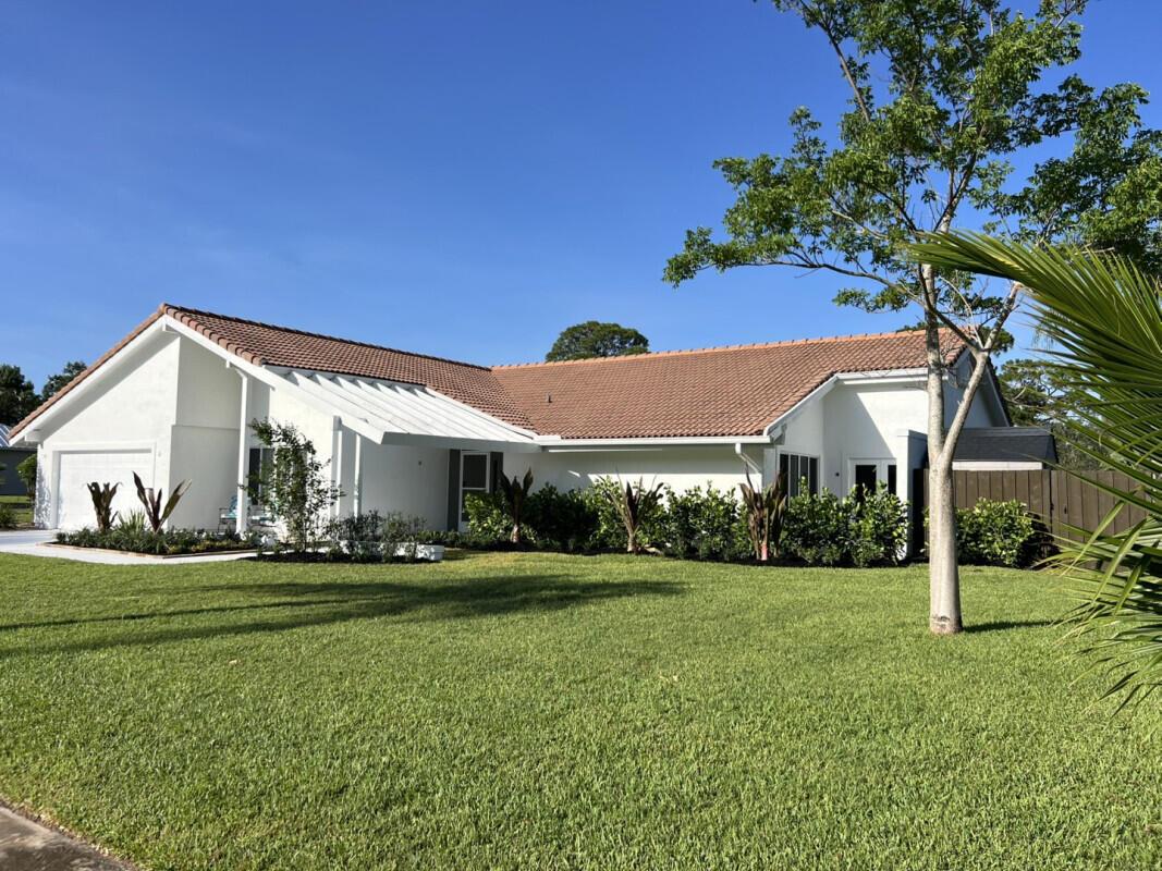 Beautiful and tropical 3-bedroom, 3-bath pool home with 2,519 sq ft of living space, perfectly situated on The Saints Golf Course in Port St. Lucie. This move-in ready property offers privacy, space, and upgrades throughout--along with no HOA and a fully fenced backyard for peace of mind.Inside, you'll find a completely upgraded kitchen featuring custom cabinetry, quartz countertops, designer fixtures, premium appliances, and extensive tile work--perfect for the home chef. The spacious layout includes two primary suites, ideal for multi-generational living or guest accommodations.Retreat to the spa-like master bath, which boasts a luxurious steam room shower powered by a new tankless water heater, creating a private wellness experience right at home.