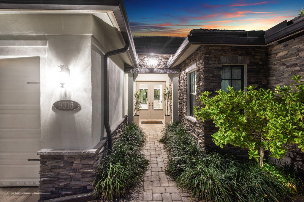 Photo of 9316 Grand Prix Lane, Boynton Beach, FL 33472 (MLS # B26050663)