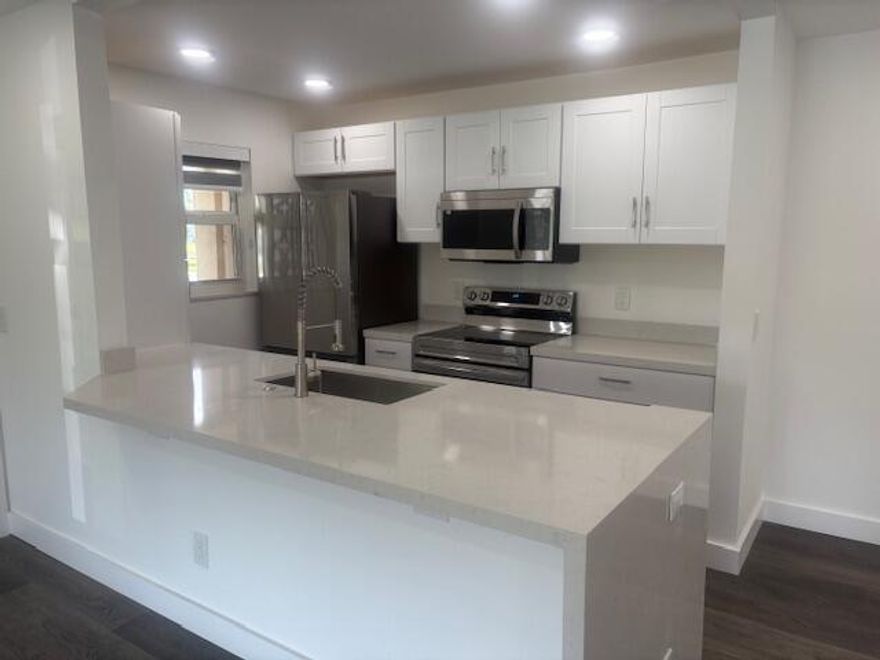 Open and airy 2-bedroom, 2-bath condo located in the sought-after 55+ community of High Point, Delray Beach. This fully updated home features brand-new appliances, all-new flooring, and an upgraded electrical panel. Enjoy custom window shades, a stunning waterfall island, and a convenient in-unit washer/dryer combo. Both bathrooms have been completely renovated, and impact windows provide peace of mind and energy efficiency. Ideally situated just minutes from vibrant downtown Delray Beach and Atlantic Avenue.