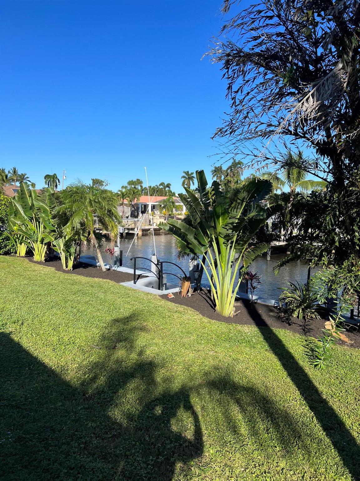 As is-Renovated in 2023, Waterfront home in Delray Beach & Best Value in Tropic Isle-HUGE, 12,611 sq.ft., CORNER LOT! 95 ft. on the water. 60+ ft. dock, wide basin to turn a boat. NO HOA!! EXCELLENT LOCATION! Walk to shops, stores, and restaurants. This home offers direct ocean access from your back yard, & ample outdoor space. IMPACT WINDOWS throughout, with 9/16 thickness, installed in June 2023. A/C 2017. NEW FRONT DOOR 2023 Inside, state of the art kitchen Quartz waterfall countertops on an extra large island, new Bosch appliances, a Dacor refrigerator, wine cooler, new washer & dryer, tankless water heater, and much more. Kasa Smart home assists in operating lights, fans, and the 75'' smart TV. 48''x 48'' Italian porcelain tile throughout adds an elegant touch- open floor pla