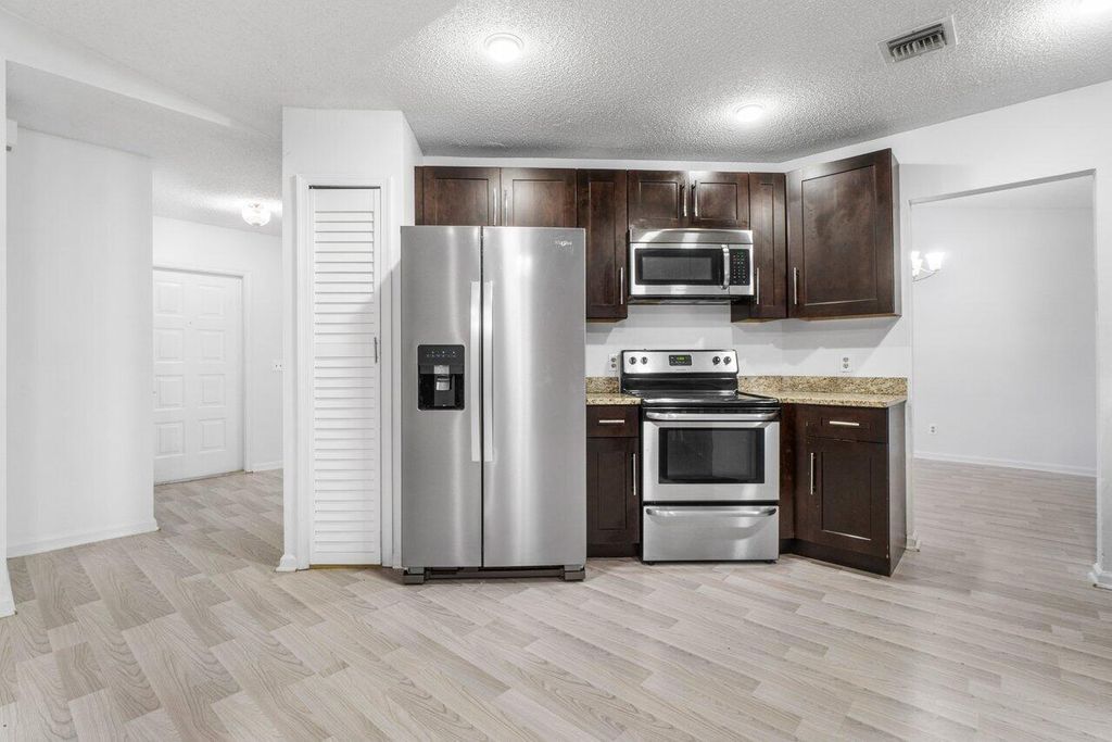 Photo of 190 Parkwood Drive S, Royal Palm Beach, FL 33411 (MLS # B26021899)