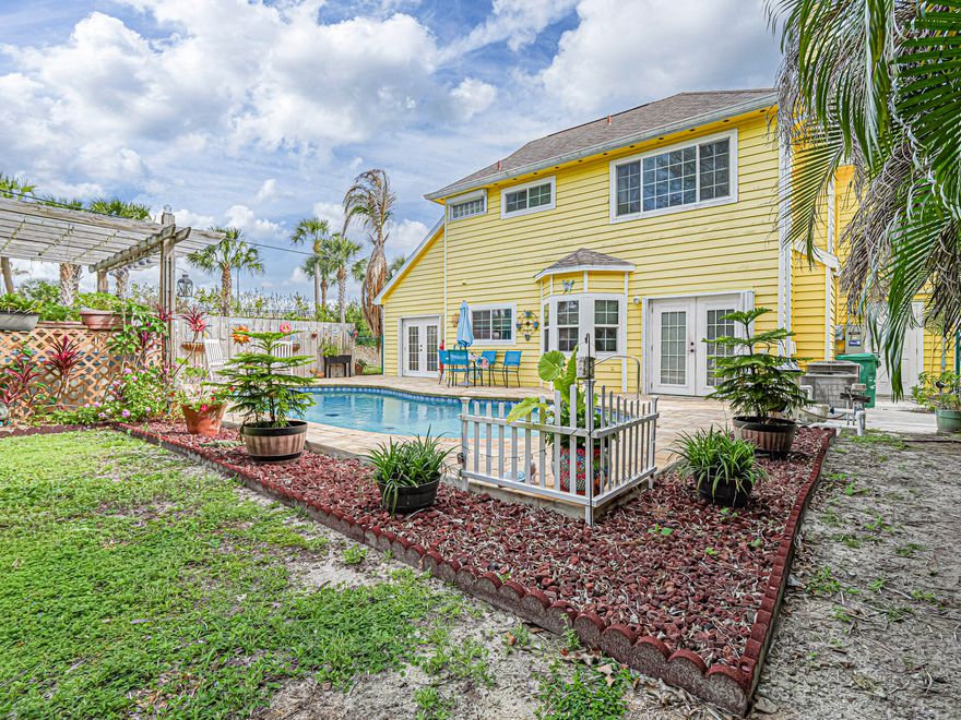 Backyard oasis pool home situated in a fabulous neighborhood and location!  This 3 Bedroom 2 1/2 Bath home has so much to offer.  Impact windows, hurricane rated garage doors,  whole house generator with full propane tank, new appliances, electric updated 3 years ago, new plumbing , master bath upgraded as well as guest bath, tankless hot water heater 3 years old, pool redone a year ago with new equipment as well, also comes with a hot springs hot tub for year round use.  The backyard is large and fenced in.  Across the street from a lovely park that has kayak ramp. Easy to show call for private showing!