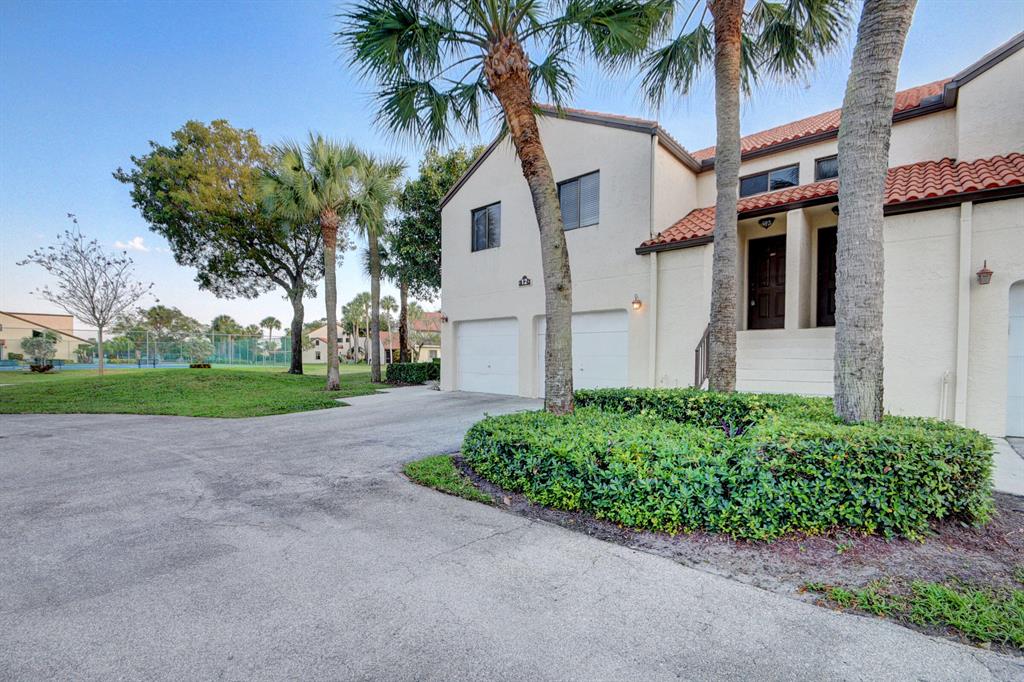 Come see this very well maintained and spacious coach- styled townhome! It has 3 well- appointed beds, 2 full baths, and a 1 car garage. Upon entering the unit you feel a grand feeling that only vaulted ceilings provide. Home features wood floors and tile througout. The master has an updated modern wood vanity and access to the lanai. The entire unit is freshly painted and its ready for its new owners! Dos Lagos is very convieniently located in central Boynton Beach. Close to the Boynton mall, and many other shops, gyms, restaurants, and the highways. This gated community offers, tennis courts, pool, walking paths, in a tranquil pet friendly environment. The maintenance fee covers all exterior maintenance, including the roof, gated security, water, cable and internet. Book now!