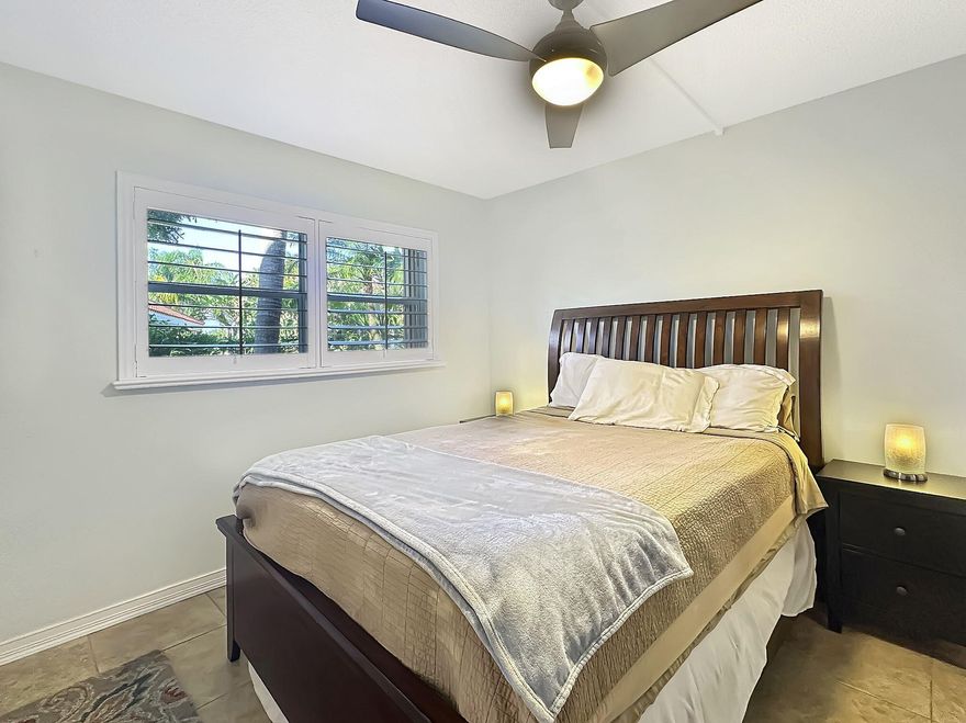 Experience modern living in this stylish 2-bedroom, 2-bath condo at Embarcadero. With a split floor plan for privacy, it features an open living space with an updated kitchen with quartz countertops, stainless steel appliances, and ample storage. The primary suite has a walk-in closet and en-suite bath, while the second bedroom is perfect for guests or as a home office. The living area under air has been expanded with the added floor to ceiling impact windows bringing the lanai area under A/C. You also have an outdoor patio area looking to the pool. Home also has a full-size stackable washer/dryer. Two pools, fitness center, 24-hour security, parking right outside your door. Embarcadero is close to dining, shopping & attractions.  OVER $27k in Assessments paid by SELLER at closing. Take I-95 to Commercial Blvd (Exit 32), go east 0.8 miles, and turn left on NE 6th Ave. Drive 0.5 miles; the property is on the right. From FL Turnpike, exit Commercial Blvd east and follow the same route. Please Confirm with GPS.