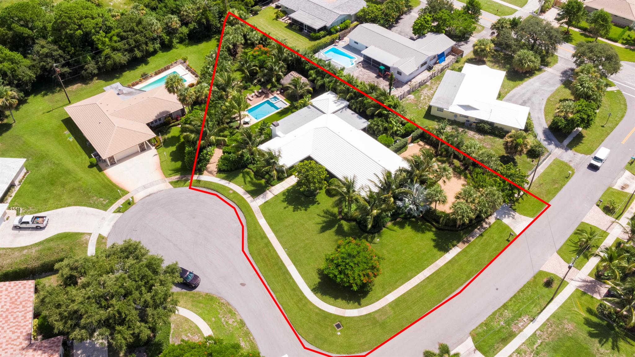This is your opportunity to own this unique estate-style home (.66 acres) in the prestigious Juno Isles neighborhood. Immerse yourself in the epitome of luxury living with this meticulously renovated ranch-style residence. Originally renovated in 2017 and recently finalized in 2023, this home boasts four bedrooms, three baths, and a two-car garage, and a salt-chlorinated heated pool with spa. Renovations include a concrete tile roof installed in 2017, complemented by a custom front door, interior doors, and impact windows. Step inside to discover a masterfully updated interior, a redesigned master bedroom custom closet, custom cabinetry in the office/den, renovated bathrooms and custom vinyl flooring throughout the residence.