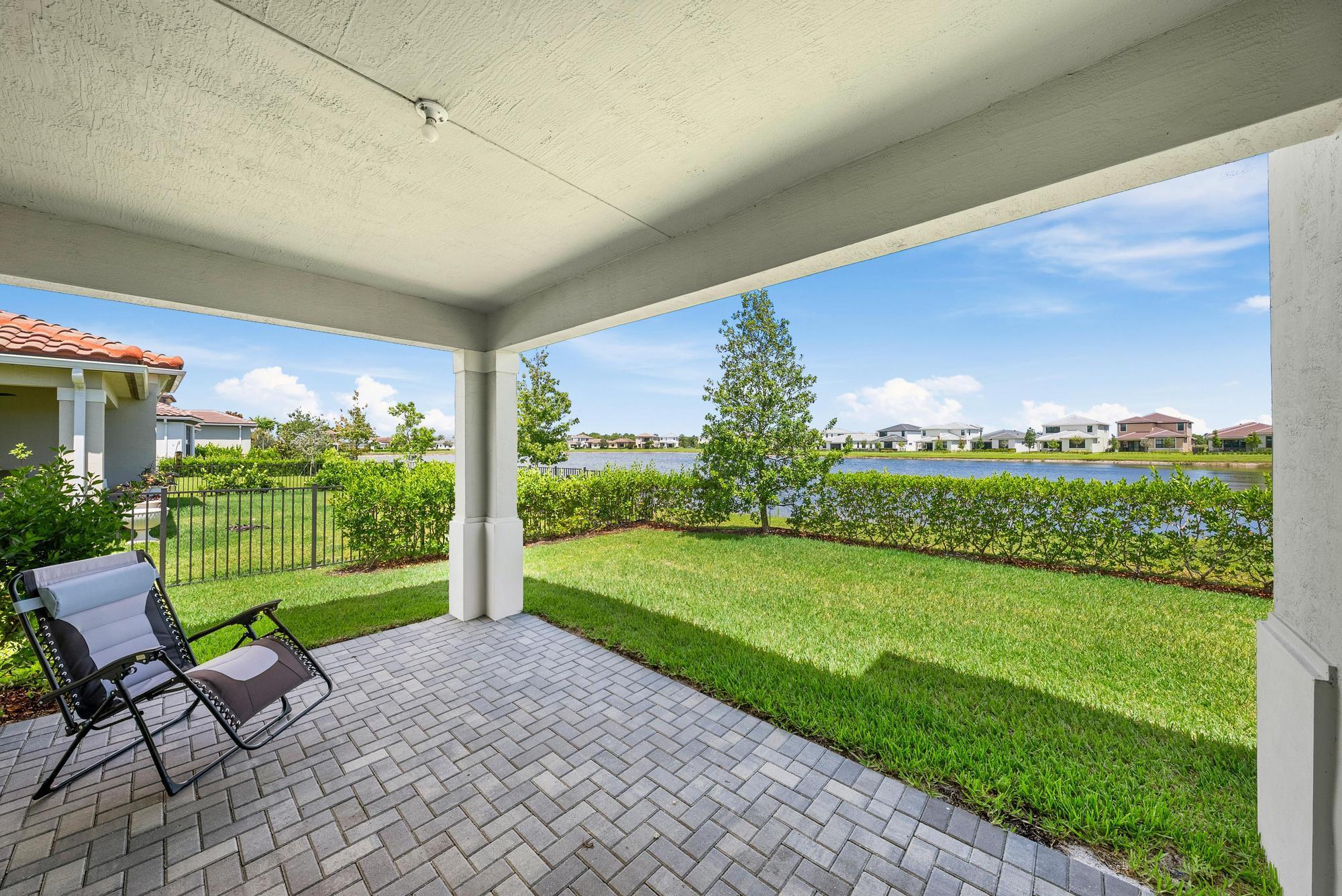 Completed in 2023 and used only lightly as a second home, this lakefront beauty in Tesoro Club is better than new, with over $20,000 in thoughtful upgrades already done--including custom closets, designer drapes, epoxy garage floor, and more. The open layout offers 3 bedrooms plus a den/flex room, 2.5 baths, and refined finishes like tray ceilings, crown molding, 10.5-ft ceilings, wood-look tile flooring, and 8-ft doors. The gourmet kitchen features quartz countertops, walk-in pantry, wall oven, and a gas cooktop. Enjoy peaceful lake views from the covered lanai in this private, gated golf community with world-class amenities.