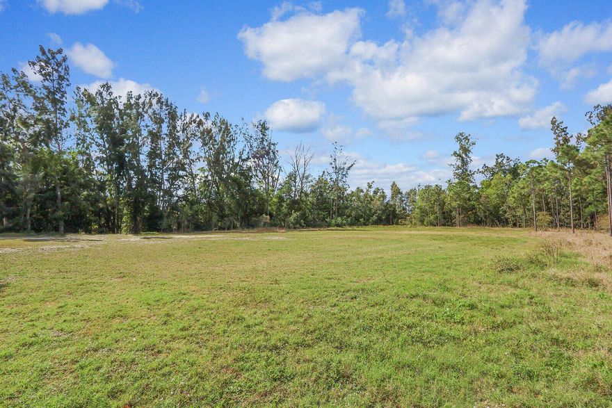 Build your dream home on this generous private 1.71 acre parcel. Lot is mostly cleared. Construction of 11000 sf home including 2 outbuildings, ADU and garage, is possible. New homes currently built nearby. Main road make it easily accessible to nearby shopping and restaurants. Indiantown Rd frontage also makes it attractive for agricultural business, i.e. nursery