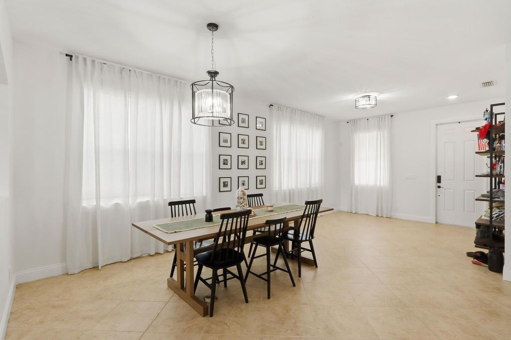 Photo of 1085 Center Stone Lane, Riviera Beach, FL 33404 (MLS # F10542578)