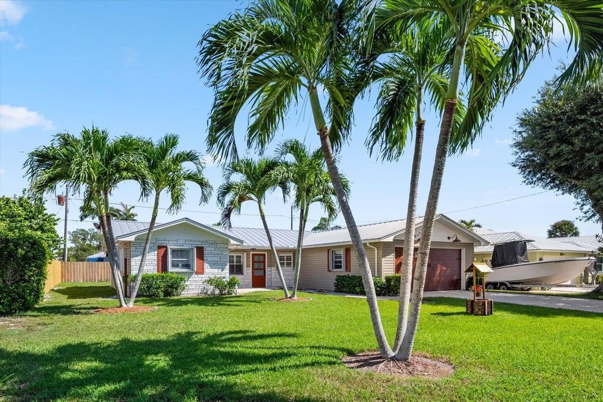 This charming 3-bedroom, 2-bath residence with a 2-car garage is nestled in one of Hobe Sound's most sought-after neighborhoods—just off Gomez Avenue with no HOA. Enjoy a beautifully landscaped yard and a fully fenced backyard, perfect for outdoor relaxation and entertaining. Inside, the home features plantation shutters, updated bathrooms, and stylish vinyl wood flooring throughout. The light and airy aesthetic complements the home's spacious and functional layout. Ideally located just minutes from Hobe Sound's pristine beaches, popular restaurants, and unique local boutiques. Available now—don't miss this rare rental opportunity in a prime location!