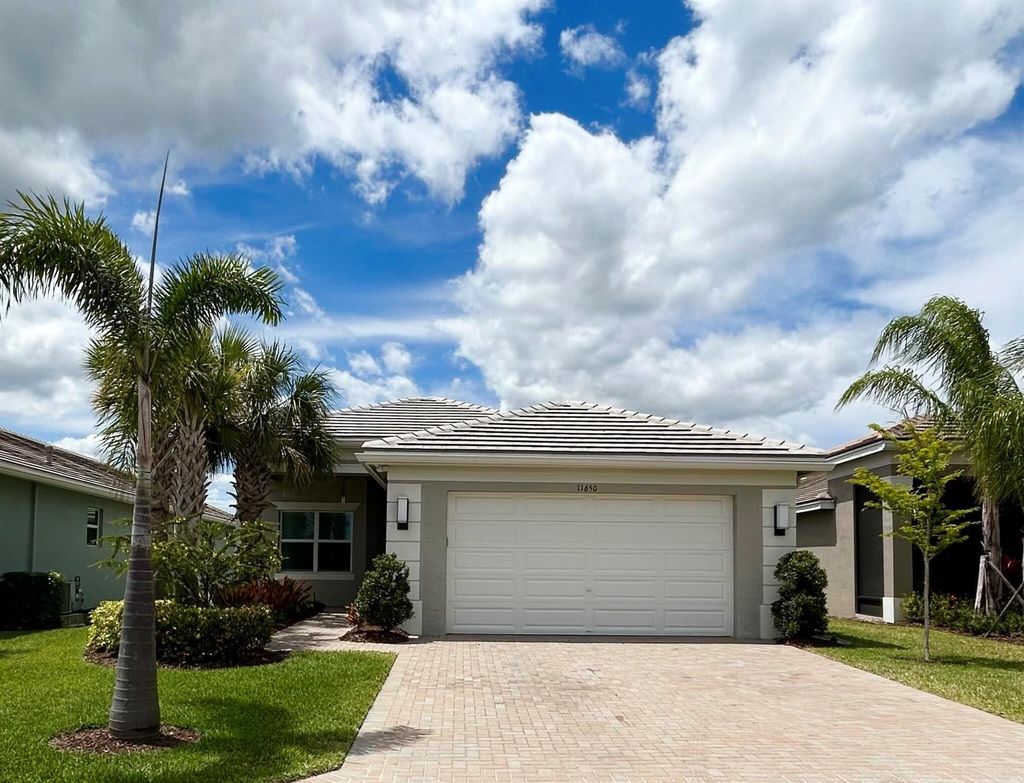 Photo of 11650 SW Moon River Way, Port Saint Lucie, FL 34987 (MLS # R10975944)
