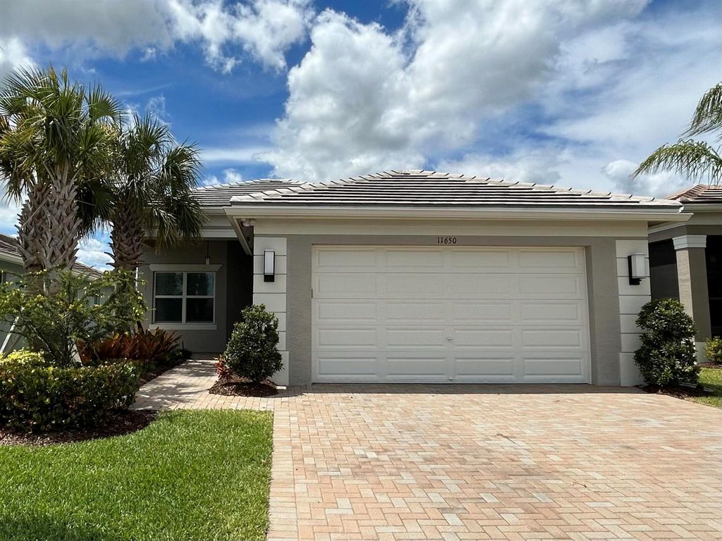 Photo of 11650 SW Moon River Way, Port Saint Lucie, FL 34987 (MLS # R10975944)