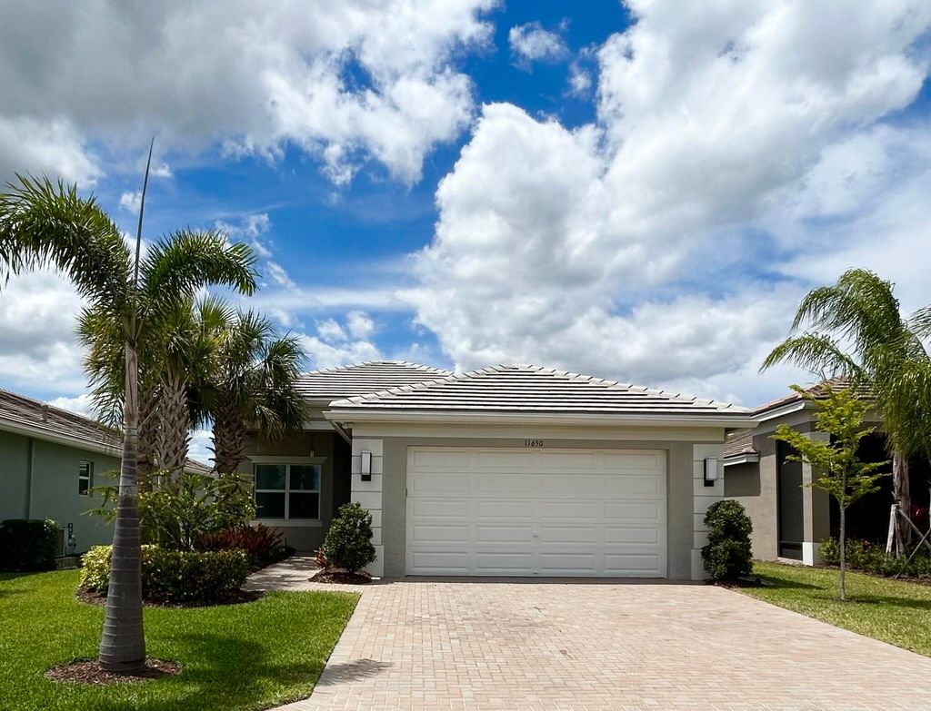 Photo of 11650 SW Moon River Way, Port Saint Lucie, FL 34987 (MLS # R10975944)