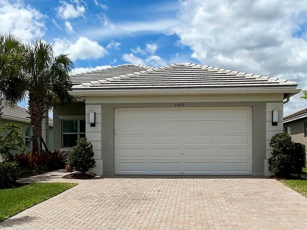 Photo of 11650 SW Moon River Way, Port Saint Lucie, FL 34987 (MLS # R10975944)