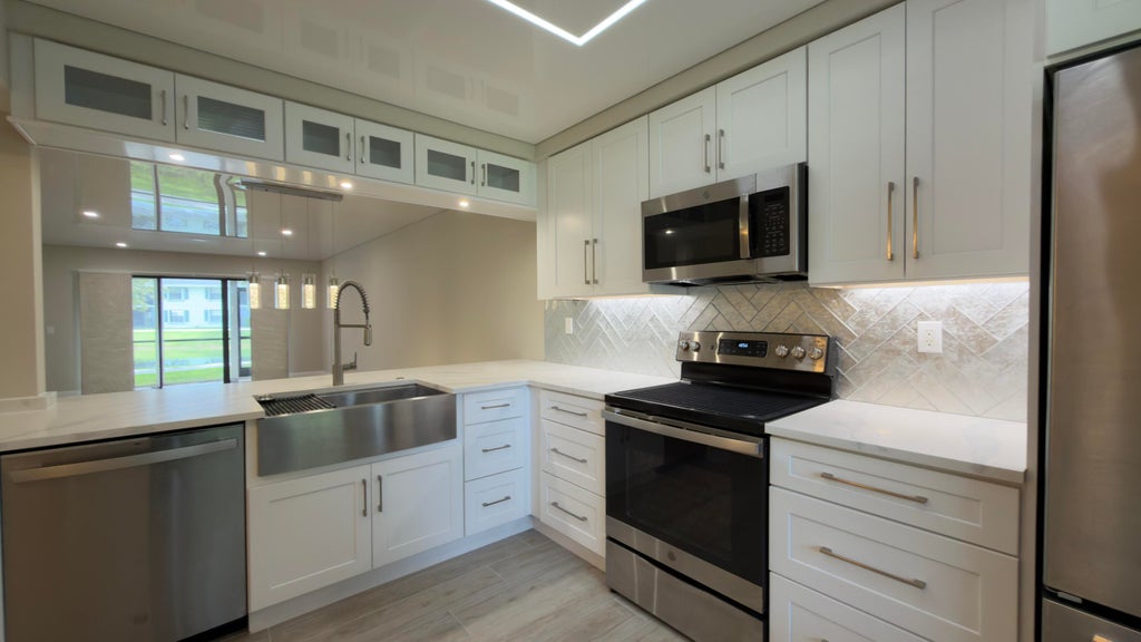 Photo of 901 Sabal Ridge Circle #C, Palm Beach Gardens, FL 33418 (MLS # B26080466)