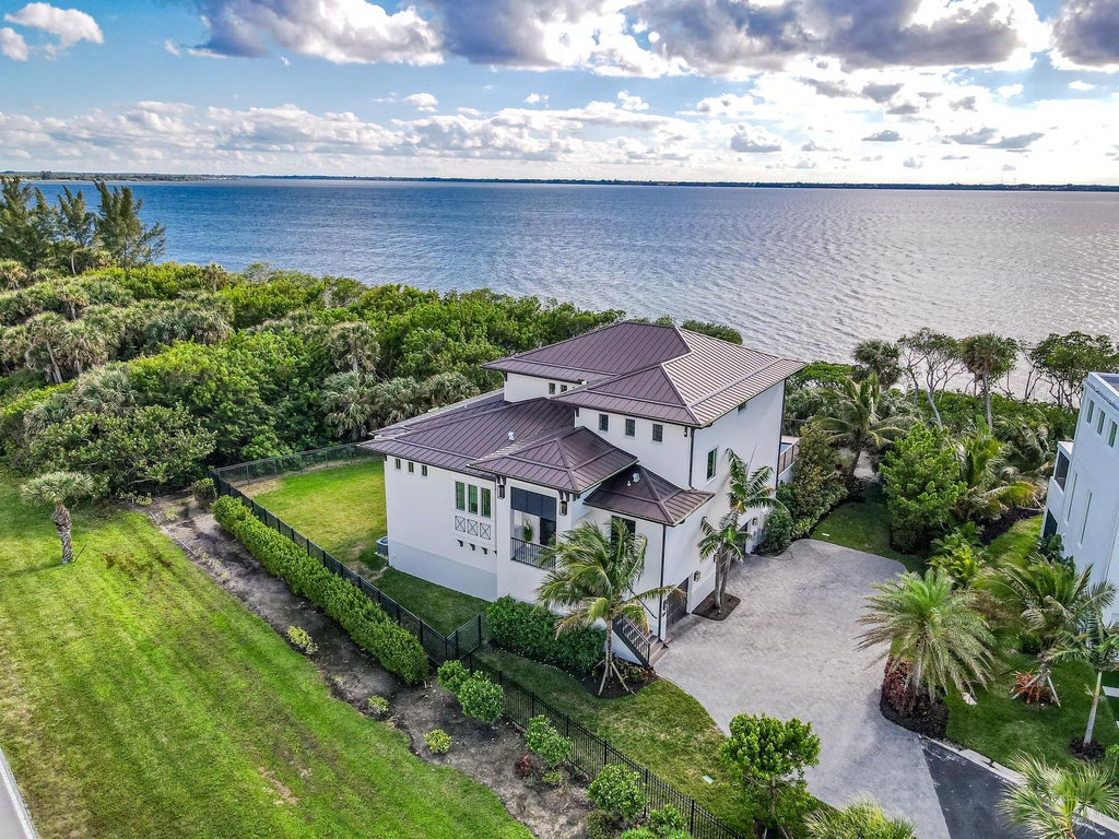 Photo of 7683 Pelican Pointe Drive, Jensen Beach, FL 34957 (MLS # B26073646)