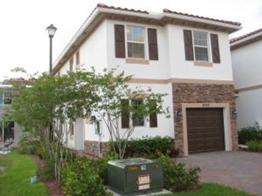 This BRAND NEW constructed townhome has never been lived in before, and boasts 4 bedrooms and 2 1/2 baths.  On the main floor is the living and dining area, with a half bath and brand new washer and dryer. The entire downstairs is tiled, and the three bedrooms are located upstairs, and all have brand new carpet. This new community is centrally located, and close to all the shopping, and only minutes to downtown West Palm Beach.