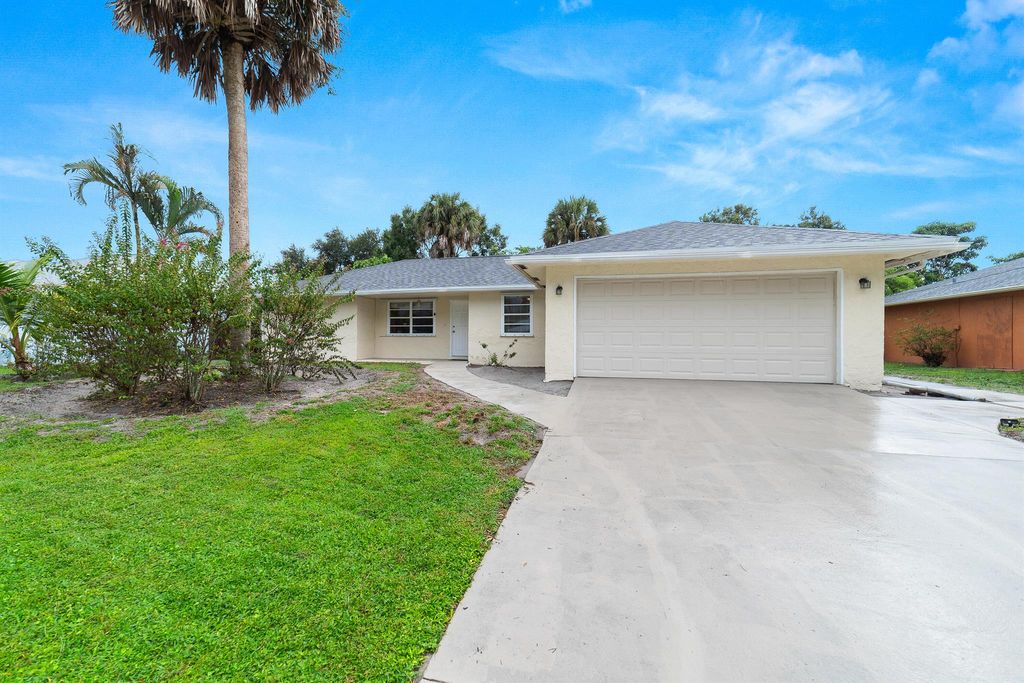 Photo of 1064 SE Euclid Lane, Port Saint Lucie, FL 34983 (MLS # R11128065)