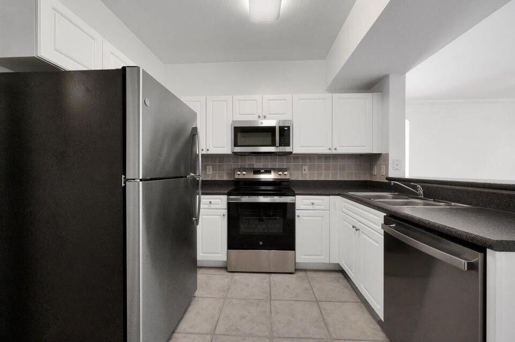 Photo of 557 SE Prescott Place, Stuart, FL 34994 (MLS # R11164393)