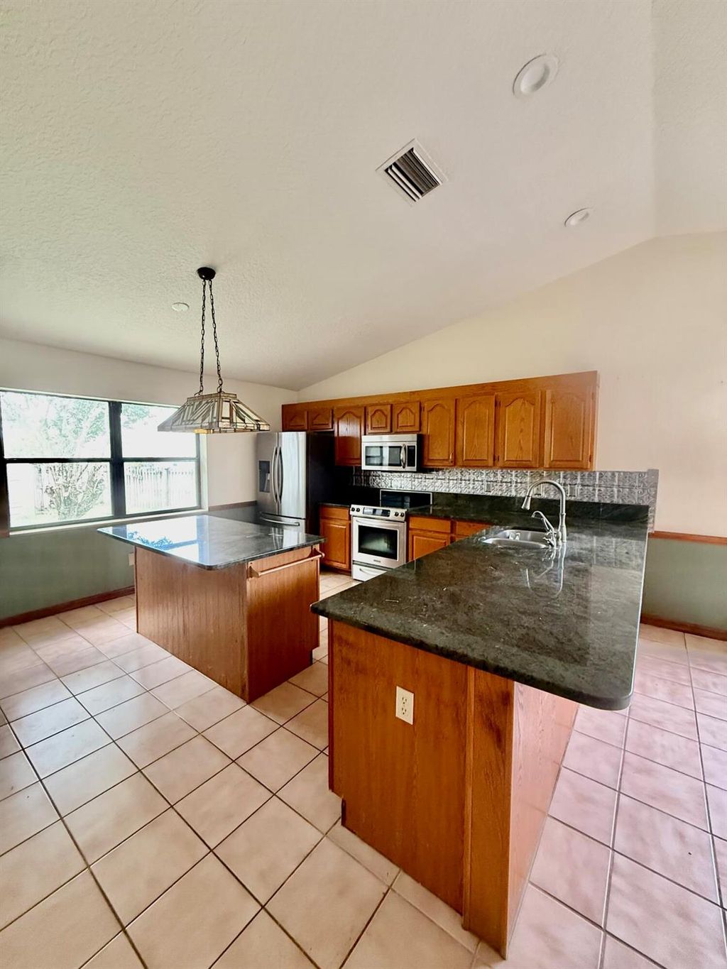 Photo of 633 SW Gailbreath Avenue, Port Saint Lucie, FL 34953 (MLS # R11104678)