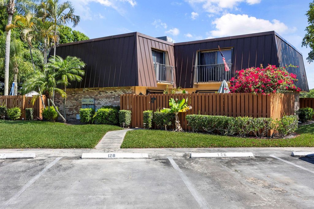 Photo of 6417 SE Windsong Lane #128, Stuart, FL 34997 (MLS # R10976503)