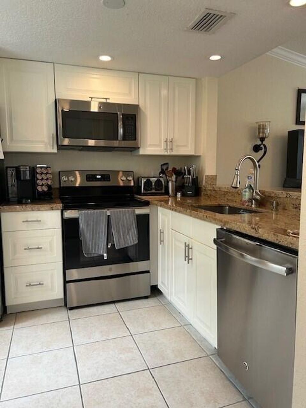 Photo of 1040 Lake Shore Drive #105, Lake Park, FL 33403 (MLS # R10980818)