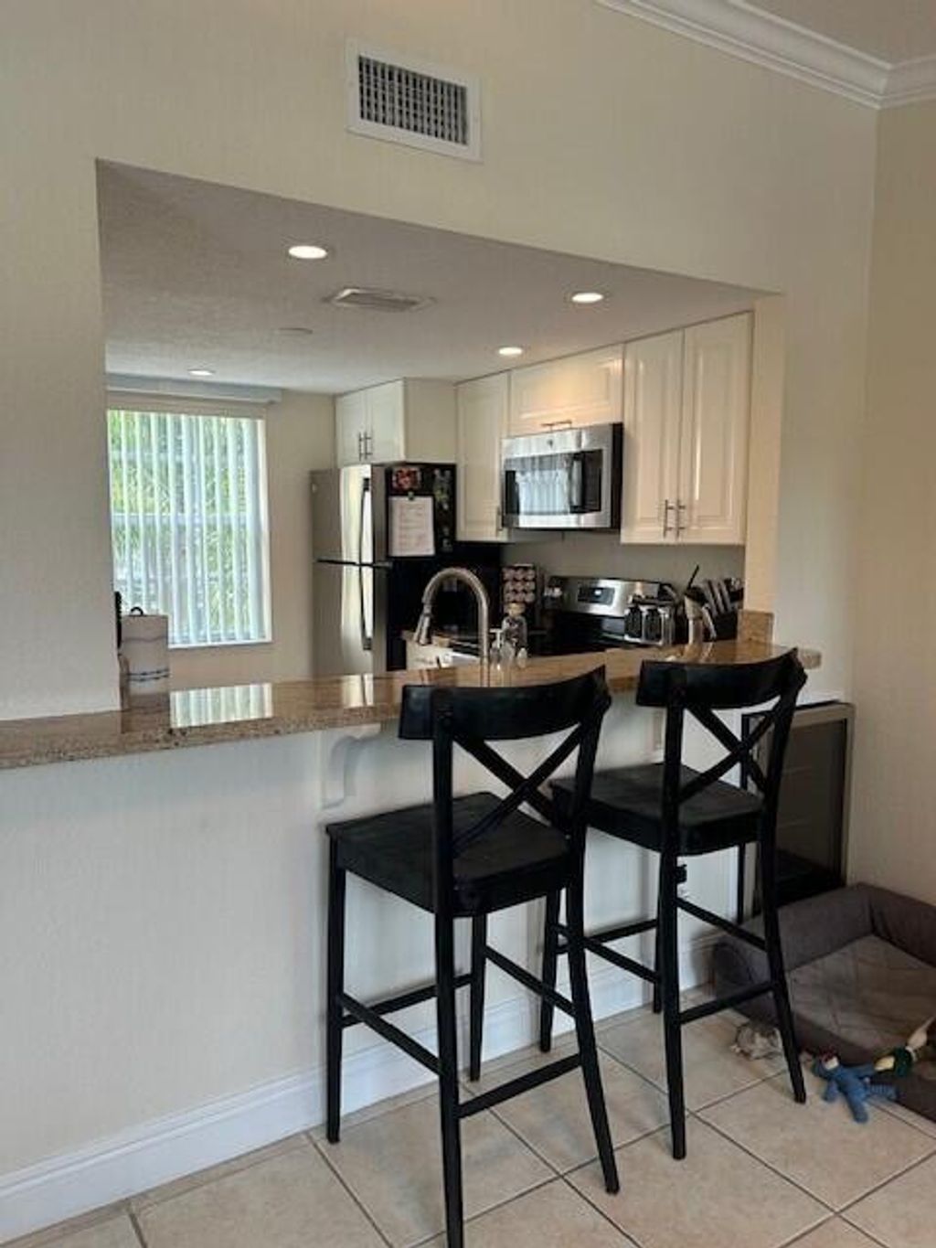 Photo of 1040 Lake Shore Drive #105, Lake Park, FL 33403 (MLS # R10980818)