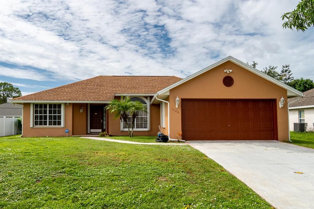 Photo of 1326 SW Janette Avenue, Port Saint Lucie, FL 34953 (MLS # R10735797)