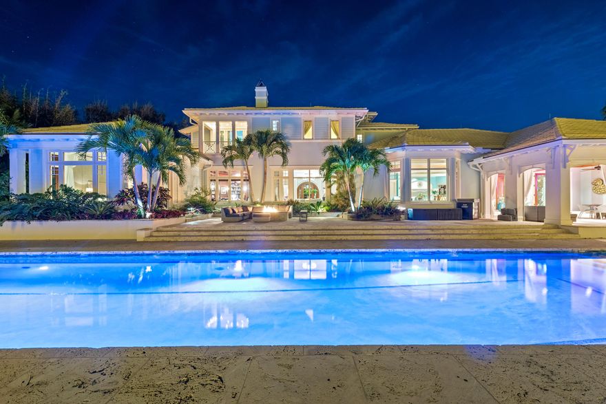 Discover Stuart's most magical waterfront estate! This stunning, 10,000 sqft. Bermuda-Colonial style home is located under the historic ''Banyan Street Tunnel'' and has endless wide-water views of the St. Lucie River and Inlet, combined with access to the private ''Twitchell Island Conservancy'' - a 3 acre island with white sandy beaches! This estate sits on over an acre, has a 120' dock with Brazilian ipe wood, 2 lifts, a floating dock, kayak storage & more. A tropical oasis complete with Olympic-size lap pool with Florida keystone deck, salt-water system, chiller & heater, jacuzzi, outdoor fire pit, BBQ and shower with custom floor and walls. Oversized patio with automatic screens. No detail has been spared in this home. State of the art DW video security system, hurricane windows & doors, 105 KW commercial generator, Crestron system, & Sonos music system. Kitchen complete with Wolf gas/convection oven, Subzero refrigerator/freezer, 50-bottle wine cooler. RARE 1,800 SF finished basement with 1,500 bottle wine cellar, not to mention a separate guest house.  2 separate 2-car garages with (at least) 4 additional outside spaces. One of the most unique homes ever to hit the market in the Sailfish Capital of the World! Additional 4-page list of upgrades, call/email for details.