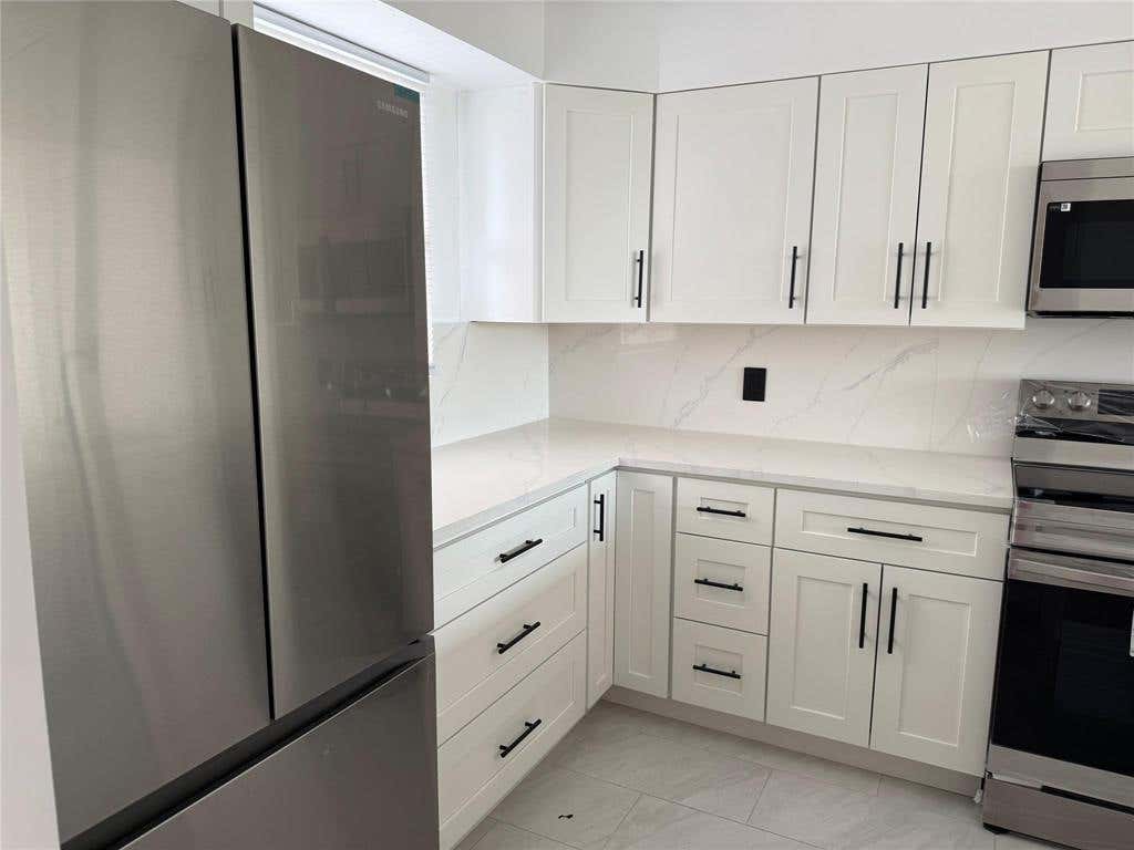 Photo of 112 ROYAL PARK Drive #4B, Oakland Park, FL 33309 (MLS # B26063466)