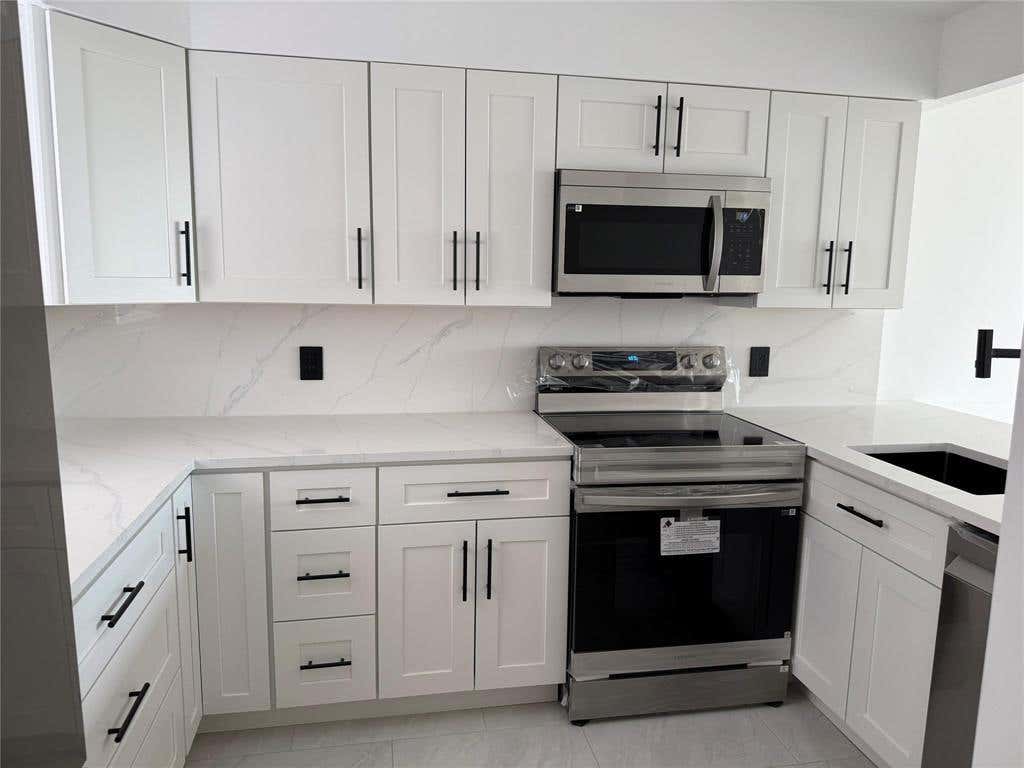 Photo of 112 ROYAL PARK Drive #4B, Oakland Park, FL 33309 (MLS # B26063466)