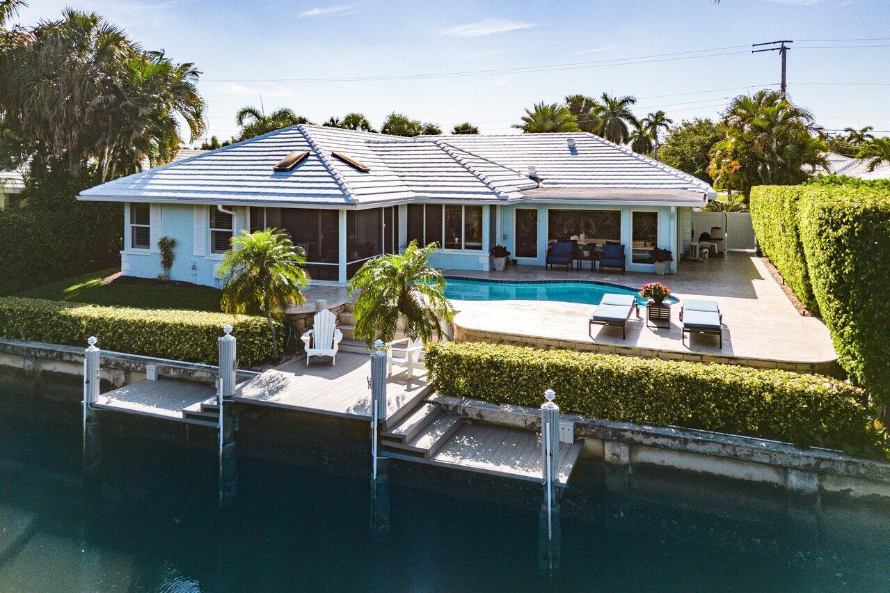Incredible, fully renovated, home with unobstructed views and deep water ocean access. This property, located in the East Boca Raton community of Camino Gardens and boasts 80 feet of water frontage overlooking a natural habitat. The backyard, with freeform pool, travertine deck, and screened in porch, offers incredible privacy. Other features include: Whole house hurricane protection, custom high-gloss kitchen cabinets, well thought out built-ins, custom walk-in closet in the primary suite, open and bright floor plan, and elegant finishes. Camino Gardens is mere moments away from downtown Boca shops and restaurants, The Boca Raton Resort & Club, and the beach.