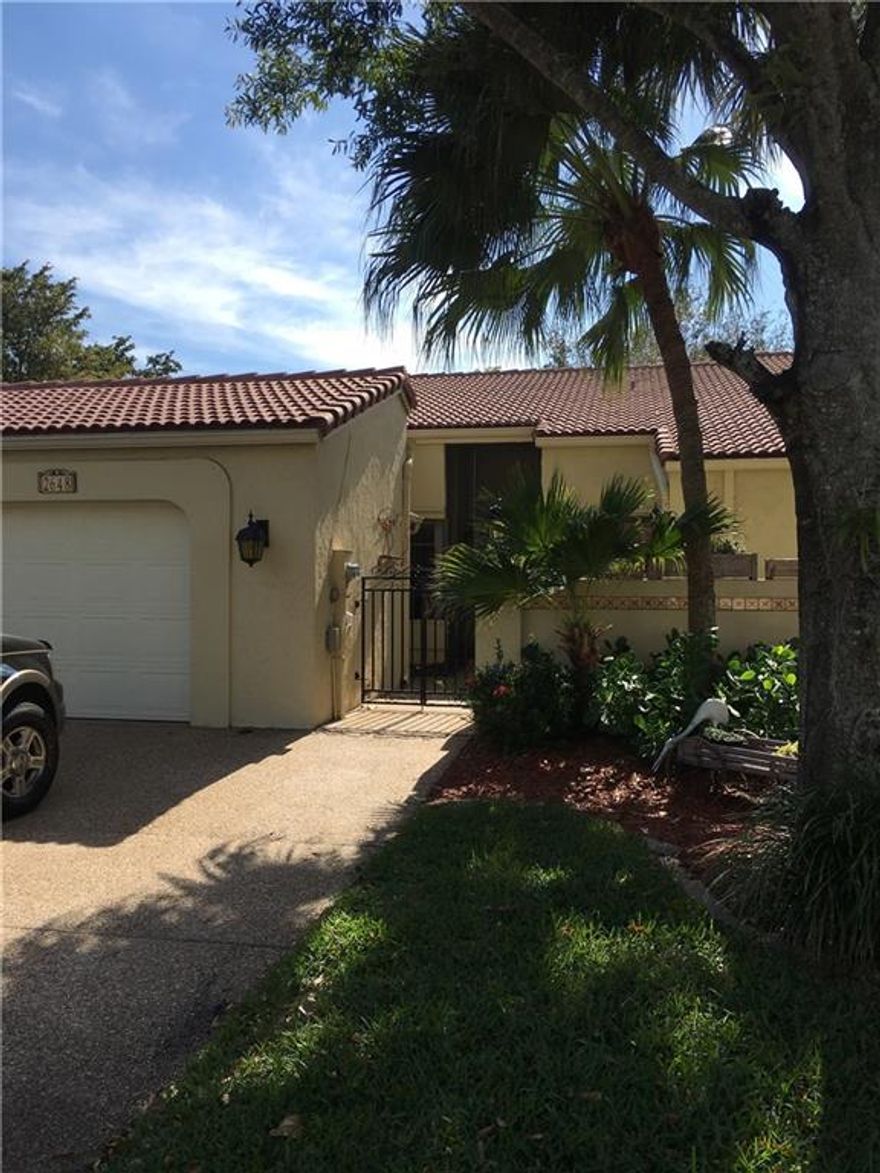 Absolutely delightful single story, lakefront 2/2 villa with charming courtyard/garden entrance and large screened patio on a lake. Wood Floors, stainless steel appliances, built-in closet in master with separate tub and shower, large open living spaces with hi-hat lighting. Small pet considered. Enjoy The Villas On The Green Lifestyle! There is a community pool and the award winning Deer Creek Country Club available to you. No membership required. Only 5 miles from the beach!